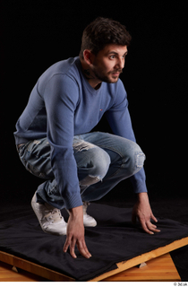 Hamza  1 blue jeans blue sweatshirt dressed kneeling white…